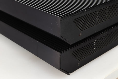Front right corner view of a pair of used Musical Fidelity MA50 Class A Monoblock Power Amplifiers in Black finish