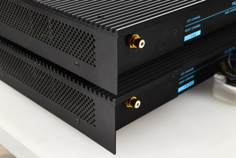 Rear left corner view of a pair of used Musical Fidelity MA50 Class A Monoblock Power Amplifiers in Black finish