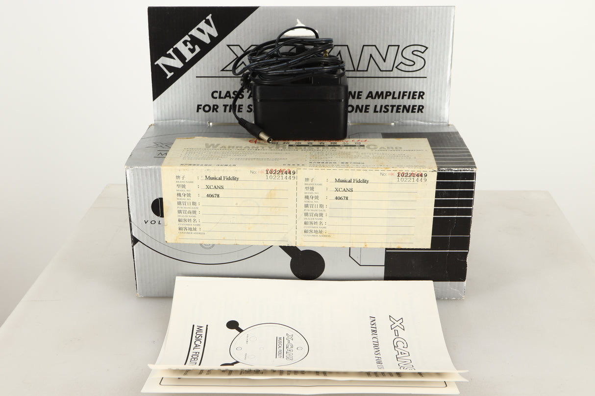 Box of a used Musical Fidelity X-Cans Headphone Amplifier with mains cable, and manual