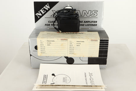 Box of a used Musical Fidelity X-Cans Headphone Amplifier with mains cable, and manual
