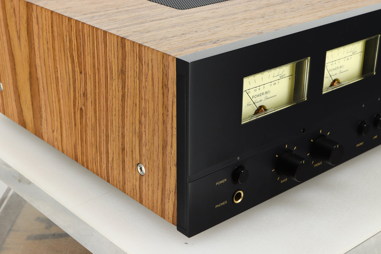 Close up view of the front left corner of a used NAD C3050 LE Integrated Amplifier