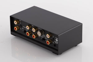 Rear left corner of a used NAD PP3i Phono / USB Pre Amplifier in a Black finish