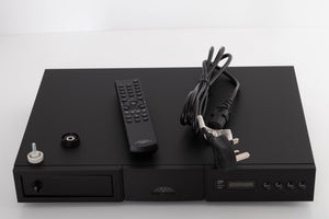 Top of a used Naim CD5 XS CD Player in a Black finish showing Remote, Batteries, CD Puck, Transit Bolt and SNAIC5