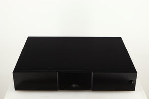 Top of a used Naim CD555PS DR Power Supply in a black finish