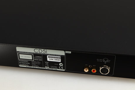 Close up of a used Naim CD5i CD Player in a black finish showing scratches on top near rear