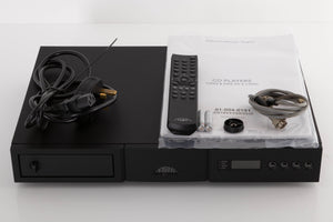 Top of a used Naim CD5si CD Player in a Black finish showing Remote, Batteries, Manual, CD Puck, Mains Cable and SNAIC5