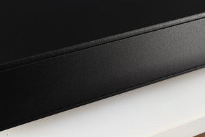 Close up of a used Naim CD5X CD Player in a black finish showing light scratch on left side