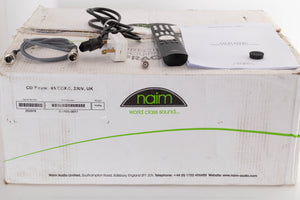 Box of a used Naim CDX2 CD Player with mains cable, remote, SNAIC, CD puck, and BNC adaptor