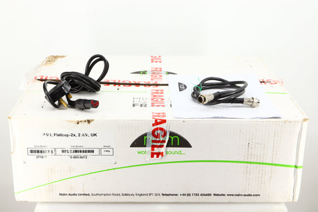 Box for a used Naim Flatcap 2X Power Supply showing Mains Cable, Manual and SNAIC5
