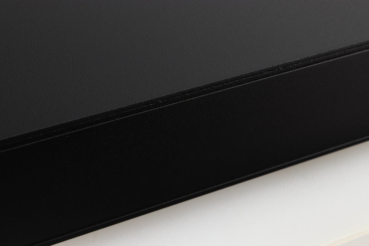 Close up of a used Naim Flatcap 2X Power Supply in a black finish showing some scratching on right side