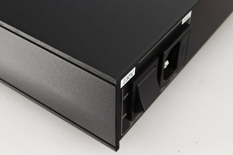 Close up of a used Naim Flatcap 2X Power Supply in a black finish showing some scratching on right side 