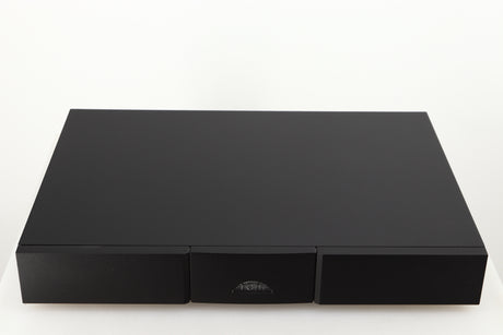 Top of a used Naim Flatcap 2X Power Supply in a black finish