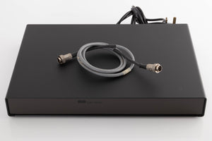 Top of a used Naim Flatcap Power Supply in a Black finish showing SNAIC5