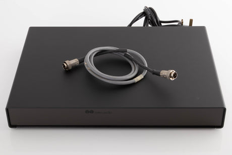 Top of a used Naim Flatcap Power Supply in a Black finish showing SNAIC5