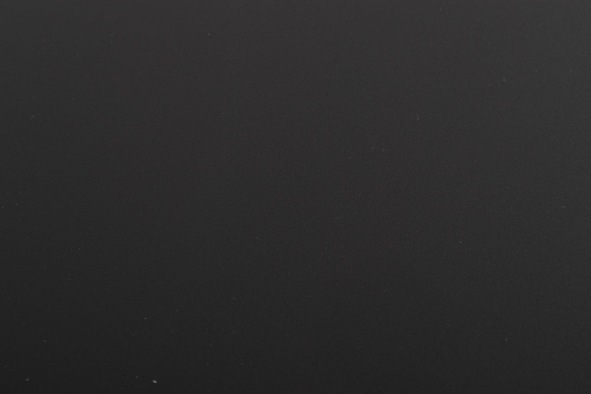 Close up of a used Naim Flatcap Power Supply in a Black finish showing scratch on top