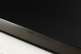 Close up of a used Naim Flatcap Power Supply in a black finish showing some of the fascia
