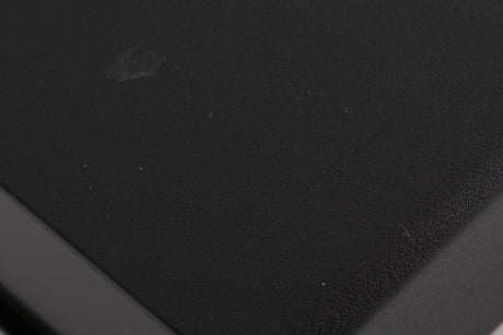 Close up of a used Naim Flatcap Power Supply in a Black finish showing mark and  scratches on top