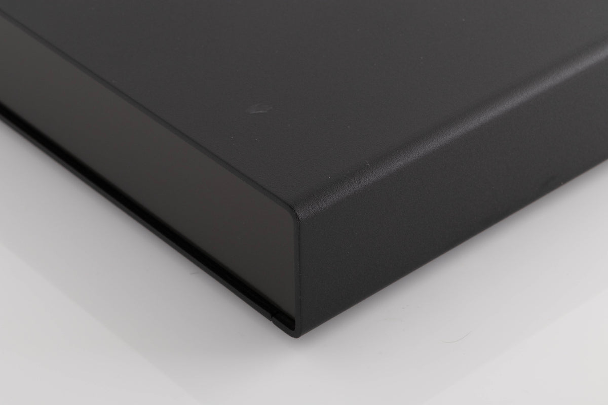 Front right corner of a used Naim Flatcap Power Supply in a Black finish