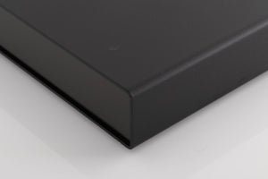 Front right corner of a used Naim Flatcap Power Supply in a Black finish