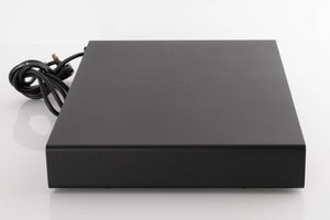 Left side view of a used Naim Flatcap Power Supply in a Black finish