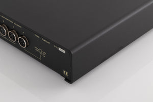Rear left corner of a used Naim Flatcap Power Supply in a Black finish