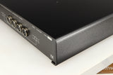 Rear left corner of a used Naim Flatcap Power Supply in a black finish