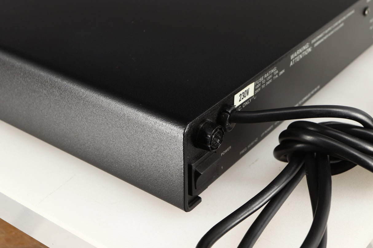 Rear right corner of a used Naim Flatcap Power Supply in a black finish