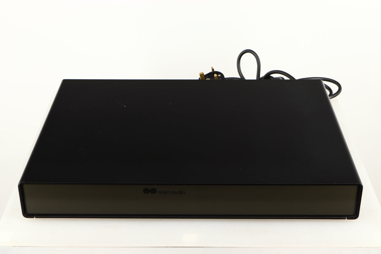 Top of a used Naim Flatcap Power Supply in a black finish