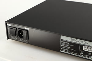 Close up of a used Naim Flatcap XS Power Supply in a black finish showing scratching on rear