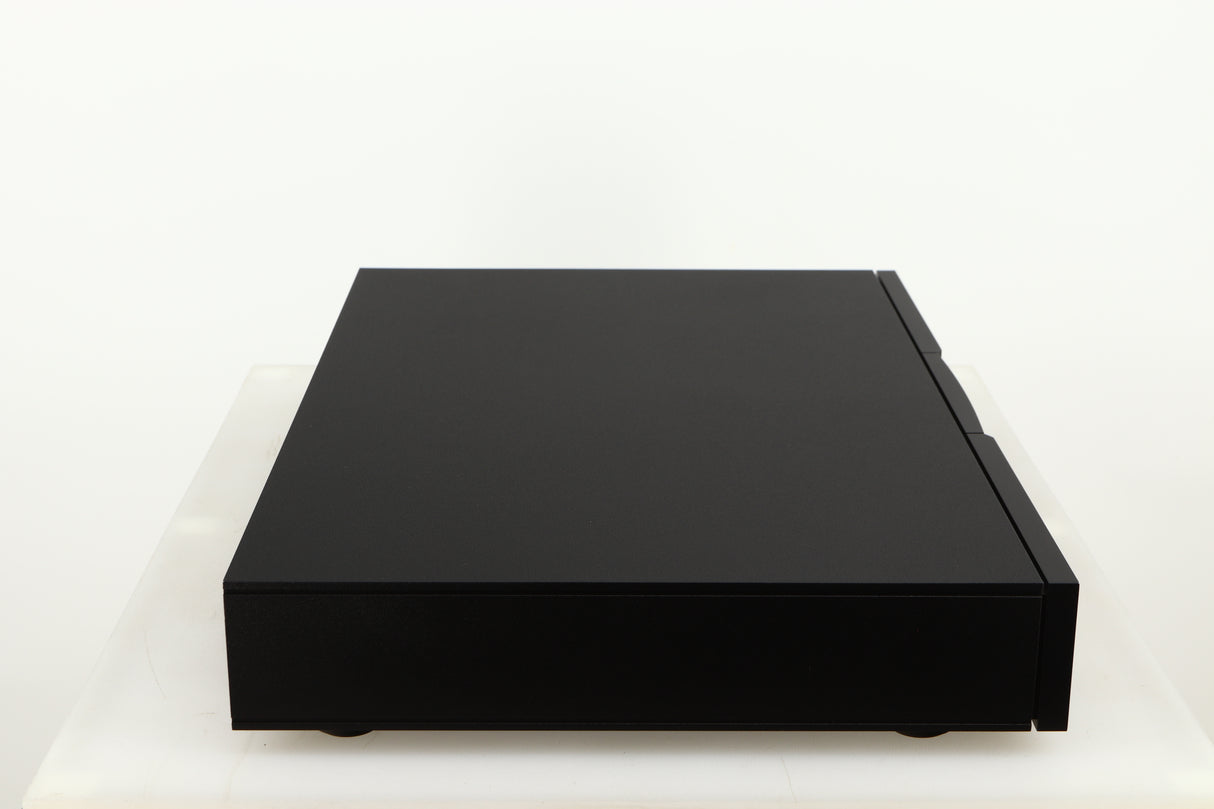 Left side view of a used Naim Flatcap XS Power Supply in a black finish