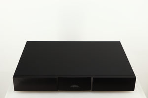 Top of a used Naim Flatcap XS Power Supply in a black finish