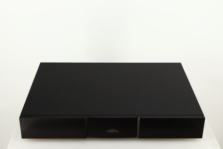 Top of a used Naim Flatcap XS Power Supply in a black finish