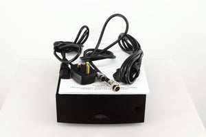 Top of a used Naim Hicap DR Power Supply in a black finish showing Manual, SNAIC5, Mains Cable and Schuko Cable