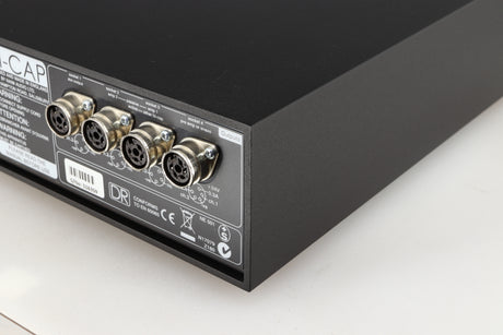 Rear left corner of a used Naim Hicap DR Power Supply in a black finish