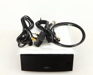 Top of a used Naim Hicap DR Power Supply in a black finish showing Manual, SNAIC5, Mains Cable and Schuko Cable