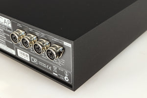 Rear left corner of a used Naim Hicap DR Power Supply in a black finish