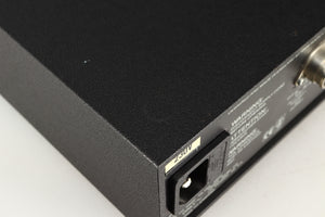 Close up of a used Naim Hicap Power Supply in a black finish showing mark on top