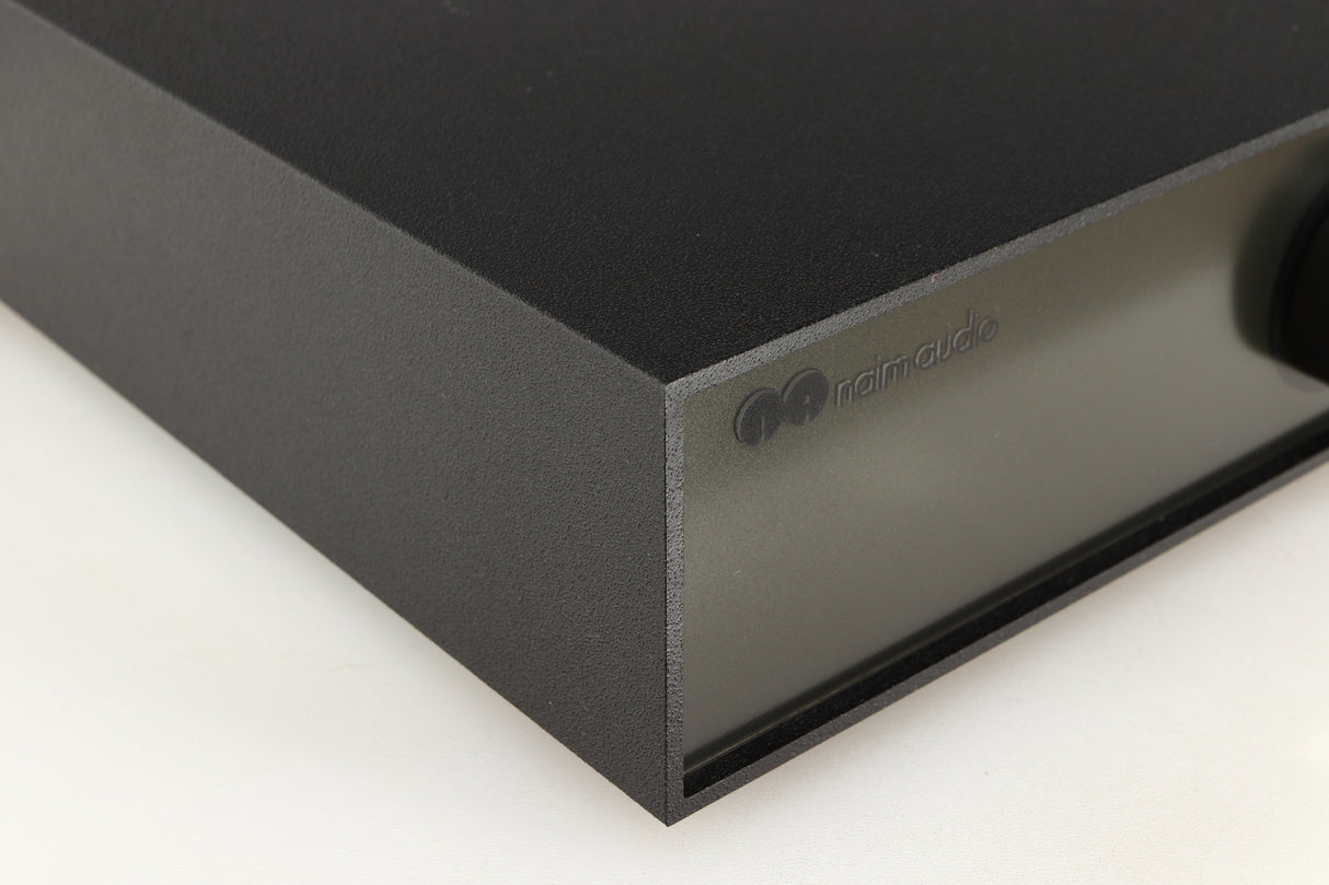 Front left corner of a used Naim Hicap Power Supply in a black finish