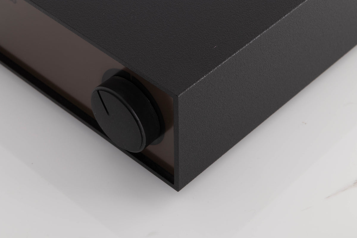 Front right corner of a used Naim Hicap Power Supply in a Black finish