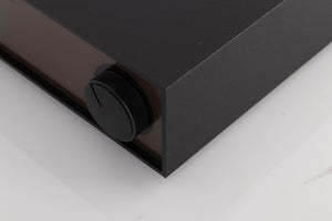 Front right corner of a used Naim Hicap Power Supply in a Black finish