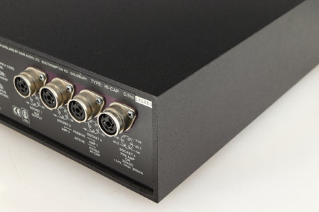 Rear left corner of a used Naim Hicap Power Supply in a black finish