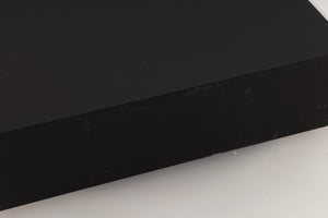 Close up view of a used Naim HiCap Power Supply showing scratching and marks on the side 