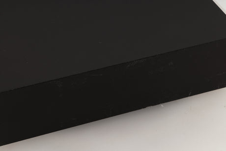 Close up view of a used Naim HiCap Power Supply showing scratching and marks on the side 