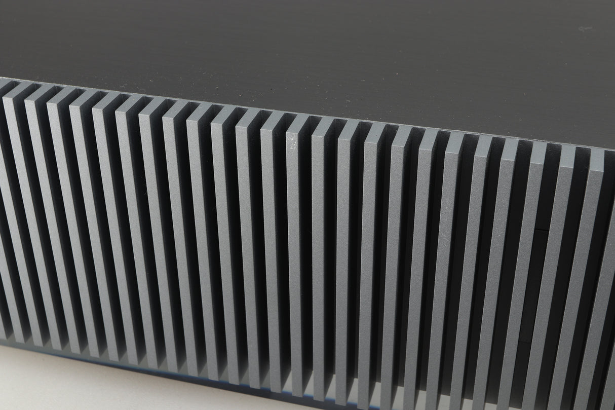 Close up of a used Naim Mu-so GEN2 Wireless Music System in a silver finish showing small graze on rear