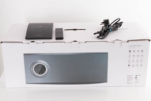 Box of a used Naim Mu-So GEN2 Wireless System with mains cable, manual, and remote
