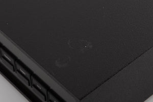 Close up of a used Naim NAC102 W/ NAPSC in a Black finish showing marks on top