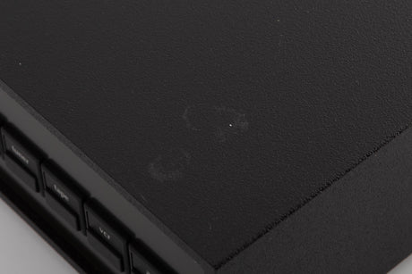 Close up of a used Naim NAC102 W/ NAPSC in a Black finish showing marks on top