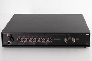 Rear view of a used Naim NAC102 W/ NAPSC in a Black finish showing NAPSC Input, DIN Inputs and DIN Outputs
