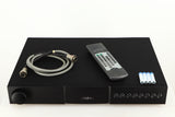 Top of a used Naim NAC112 Pre Amplifier in a black finish showing Remote, 4x Batteries and SNAIC5