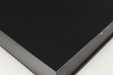 Close up of a used Naim NAC112 Pre Amplifier in a black finish showing scratching on top